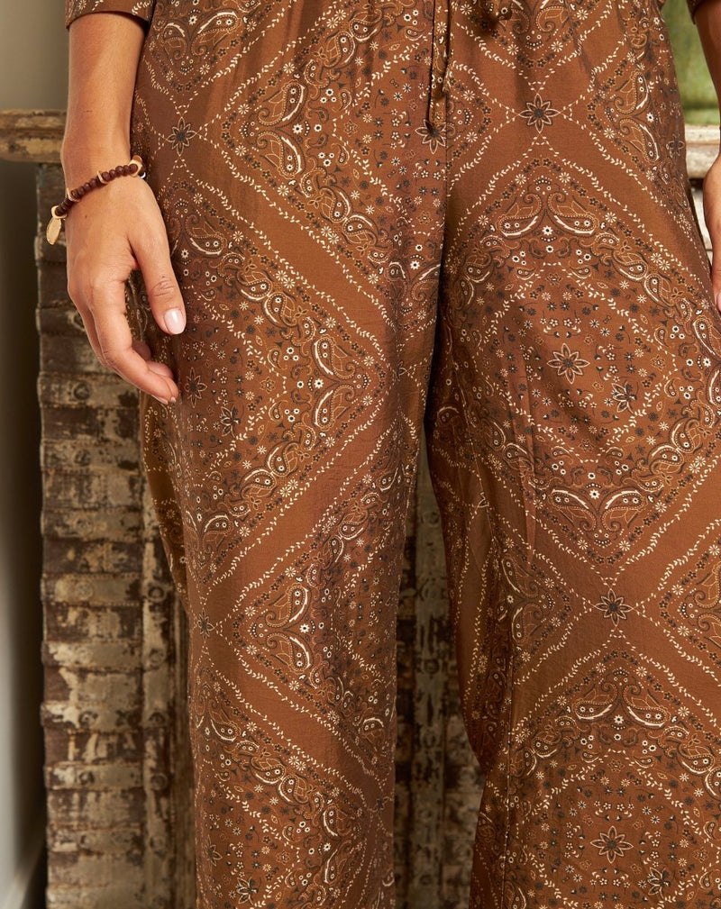 PANTALÓN FLORES MONA MARRÓN - Monica Ecco
