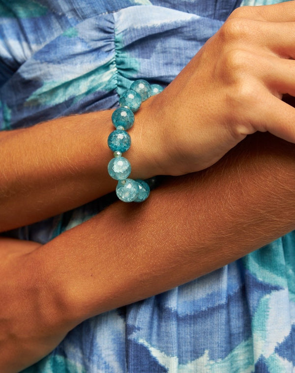 PULSERA ELÁSTICA BOLITAS CRISTAL AZUL - Monica Ecco