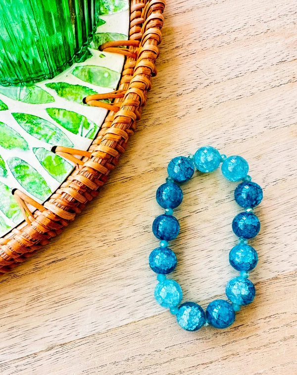 PULSERA ELÁSTICA BOLITAS CRISTAL AZUL - Monica Ecco